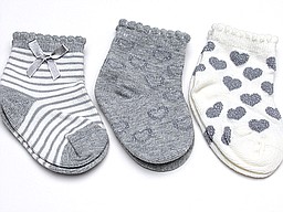 Lurex baby socks with bow and hearts on them Lurex baby socks with bow and hearts on them