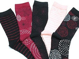 Five pair of socks with lines and circles in black and red